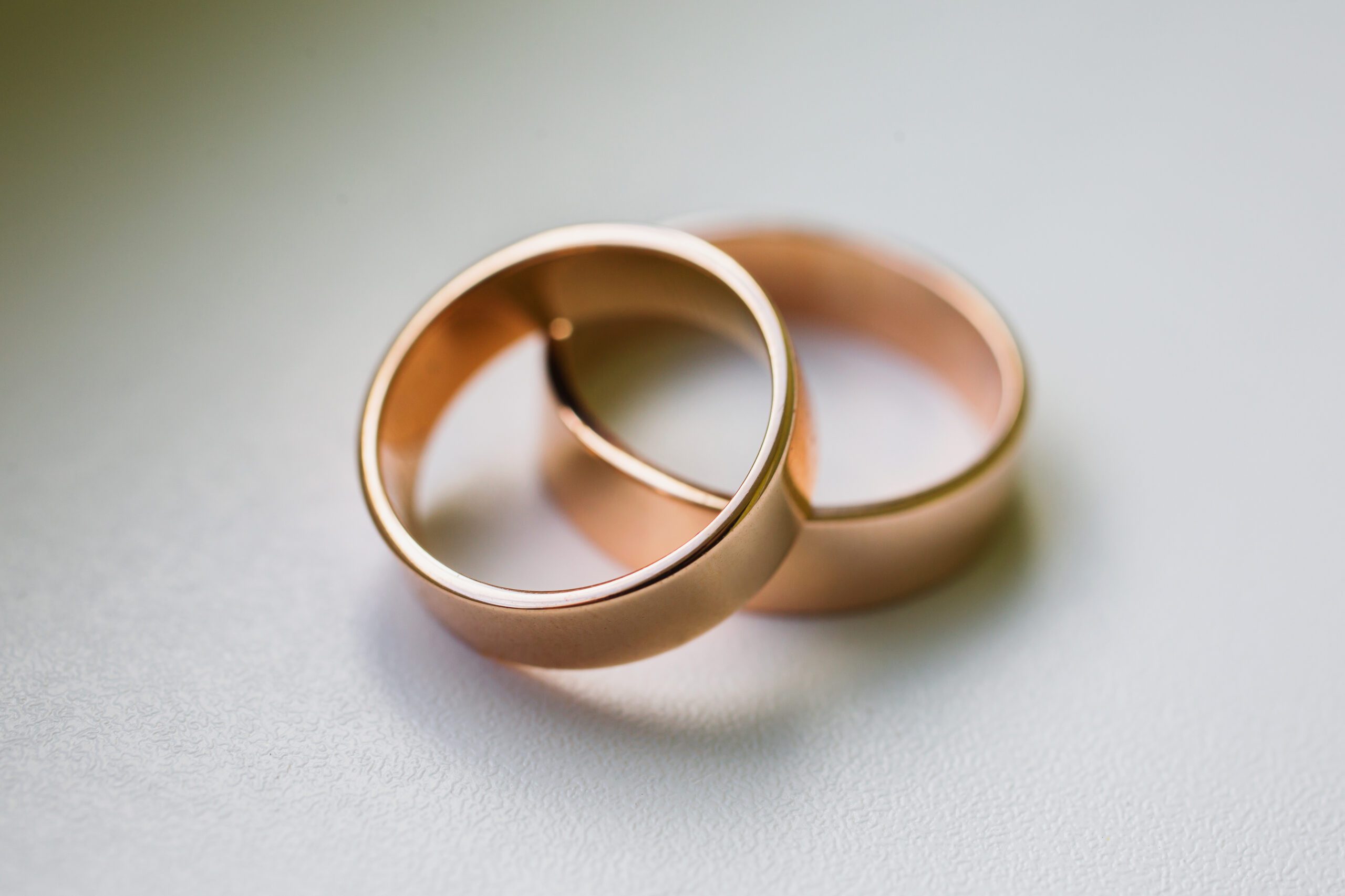 Wedding rings on a white background, wedding bands, infinity sign of the rings